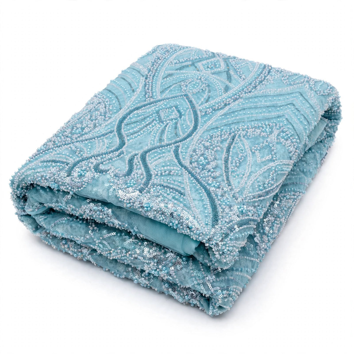 Tissu perlage bleu ciel à feuillages ondulés, au mètre